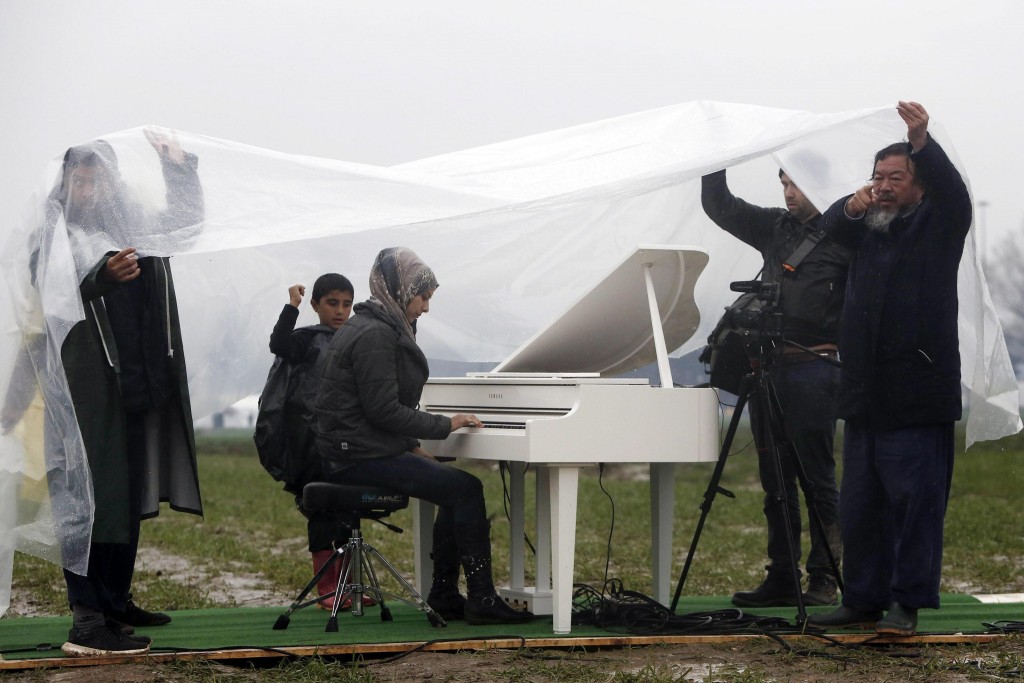 Ai Weiwei during a performance at a refugee camp on the Greek-Macedonian border